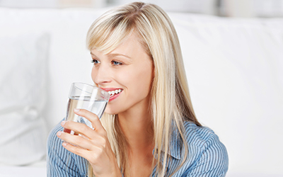 Woman drinking a glass of water