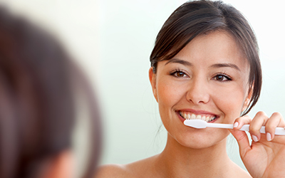 Woman brushing her teeth
