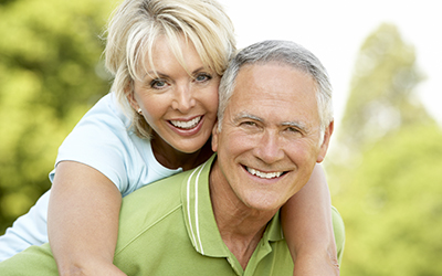 An older woman and man smiling