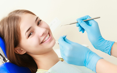 A young female sitting in a dental chair