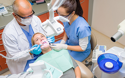 A woman having dental work done. 
